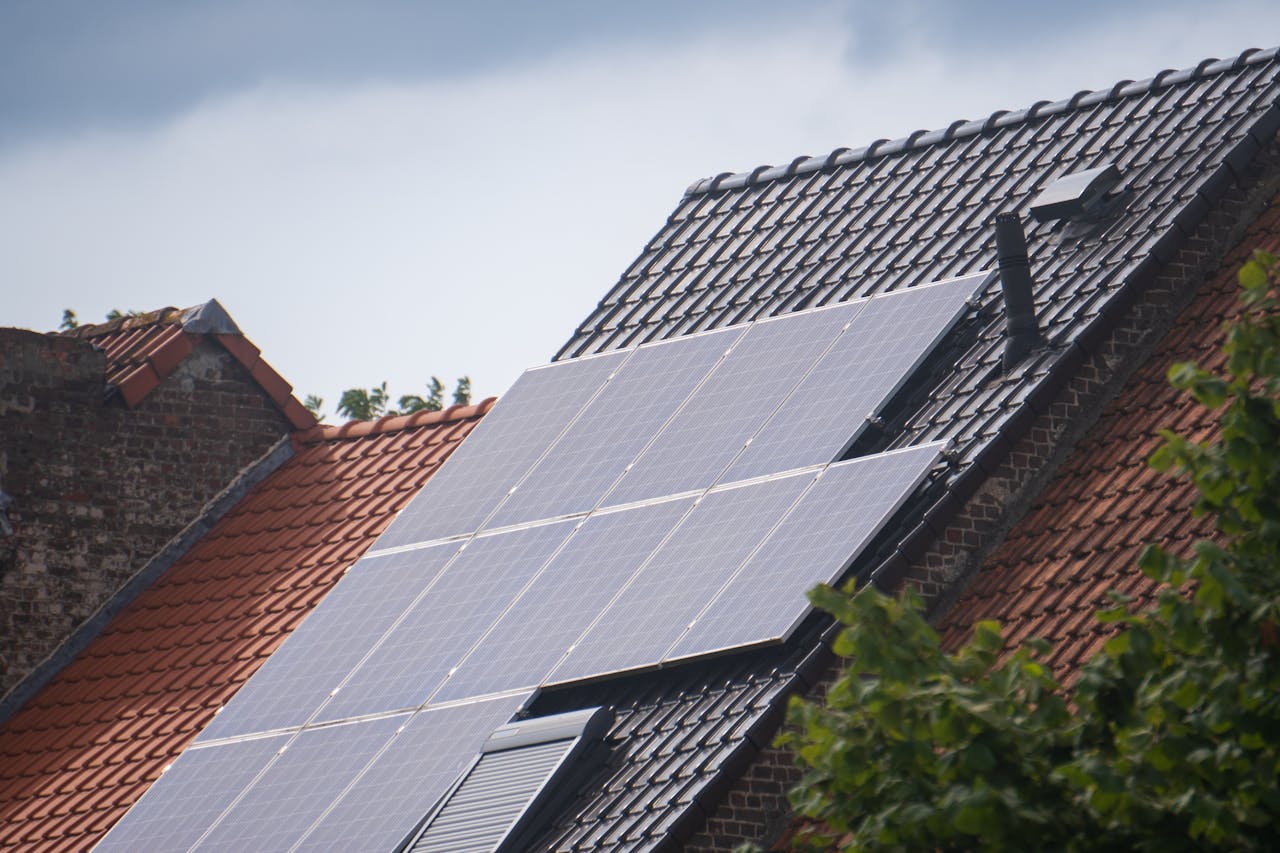 about-01 Solar panels installed on a residential rooftop, showcasing eco-friendly renewable energy solutions.
